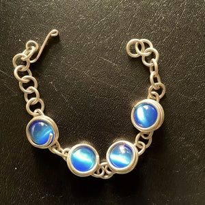 Lovely silver bracelet with blue stones. Adjustable clasp. From a museum store